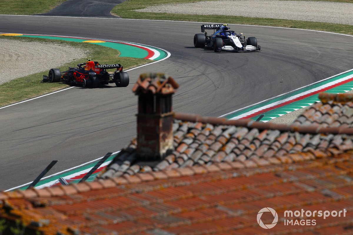 Nicholas Latifi, Williams FW43B, approaches Sergio Perez, Red Bull Racing RB16B, who has stopped on track