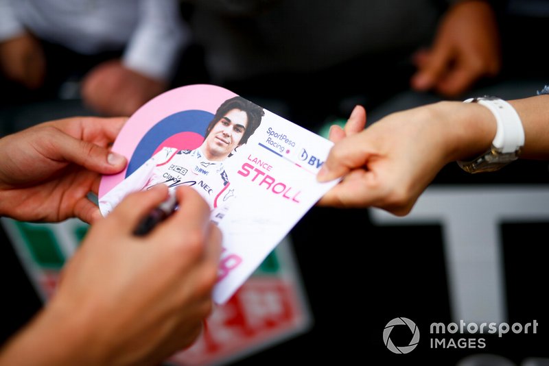 Lance Stroll, Racing Point signs a autograph for a fan