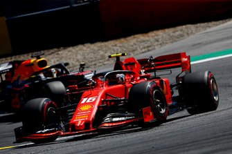 Charles Leclerc, Ferrari SF90, leads Max Verstappen, Red Bull Racing RB15