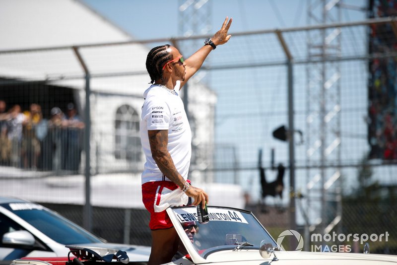 Lewis Hamilton, Mercedes AMG F1, waves to the crowd during the drivers parade