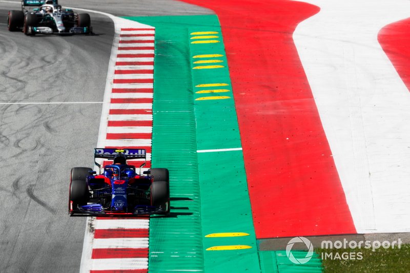 Alexander Albon, Toro Rosso STR14, leads Lewis Hamilton, Mercedes AMG F1 W10