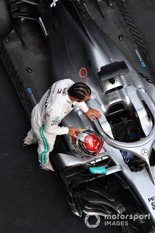 Lewis Hamilton, Mercedes AMG F1, 1st position, inspects his car after the race