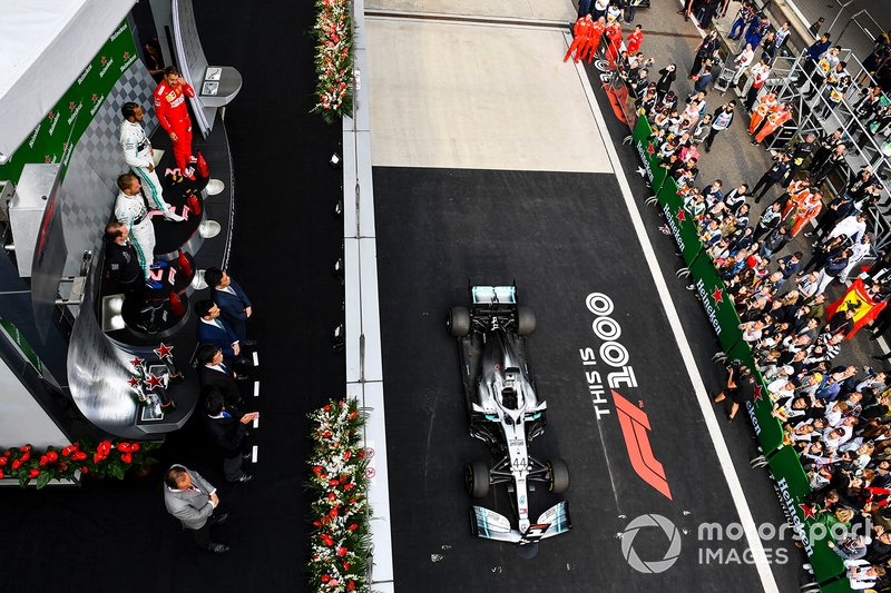 Valtteri Bottas, Mercedes AMG F1, Race Winner Lewis Hamilton, Mercedes AMG F1 and Sebastian Vettel, Ferrari on the podium with 1000th Race Branding 