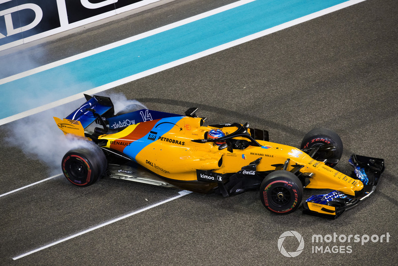 Fernando Alonso, McLaren MCL33, performs donuts on the grid at the end of the race