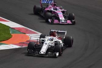 Marcus Ericsson, Sauber C37 and Sergio Perez, Racing Point Force India VJM11