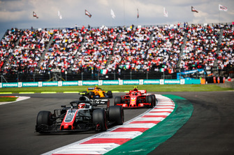 Kevin Magnussen, Haas F1 Team VF-18, leads Kimi Raikkonen, Ferrari SF71H, and Stoffel Vandoorne, McLaren MCL33
