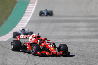 Kimi Raikkonen, Ferrari SF71H, leads Lewis Hamilton, Mercedes AMG F1 W09 EQ Power+