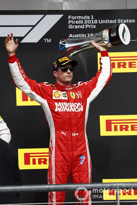 Kimi Raikkonen, Ferrari, 1st position, with his trophy