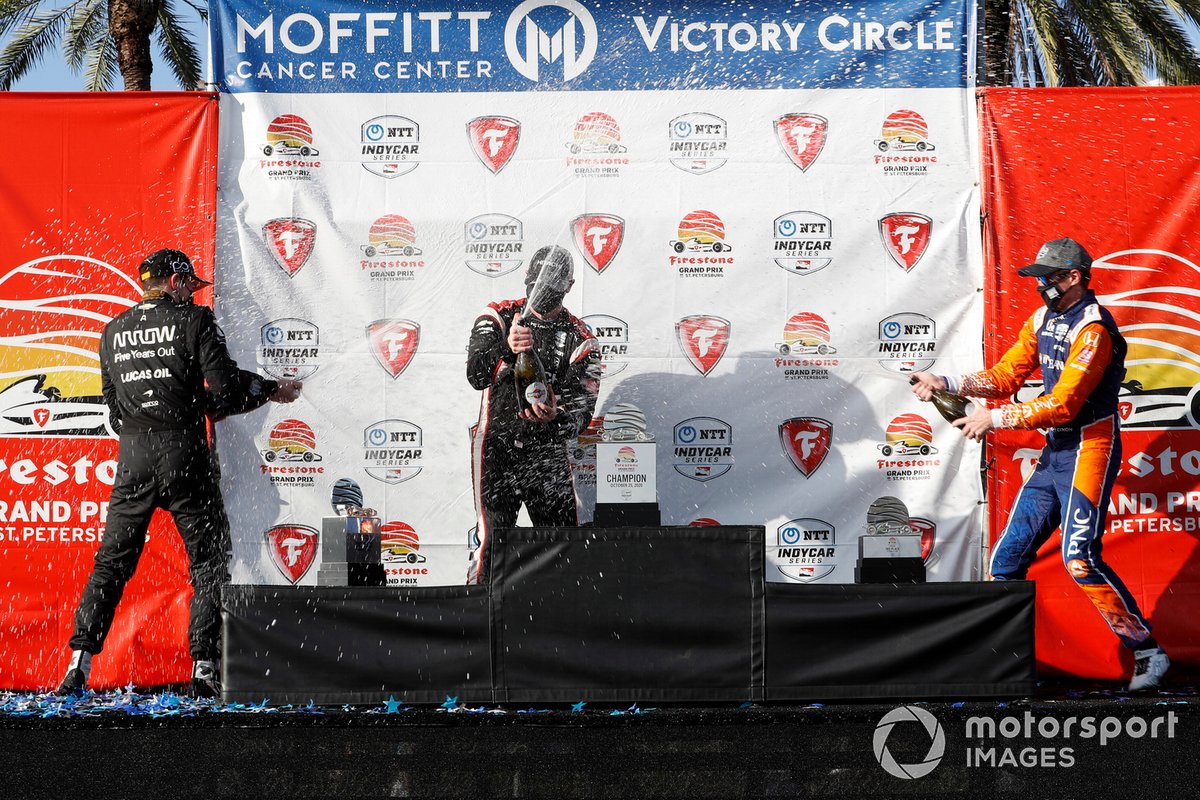 Josef Newgarden, Team Penske Chevrolet, Patricio O'Ward, Arrow McLaren SP Chevrolet , Scott Dixon, Chip Ganassi Racing Honda celebrate on the podium with champagne