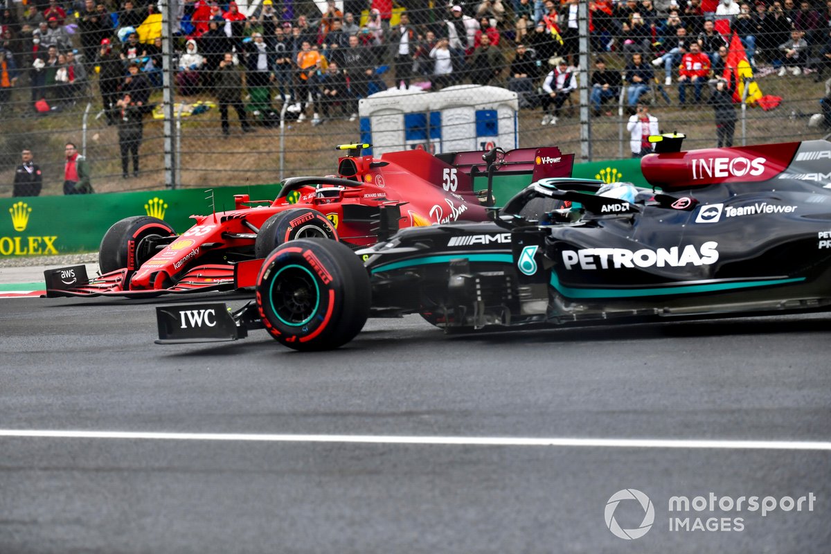 Valtteri Bottas, Mercedes W12, passes and avoids Carlos Sainz Jr, Ferrari SF21