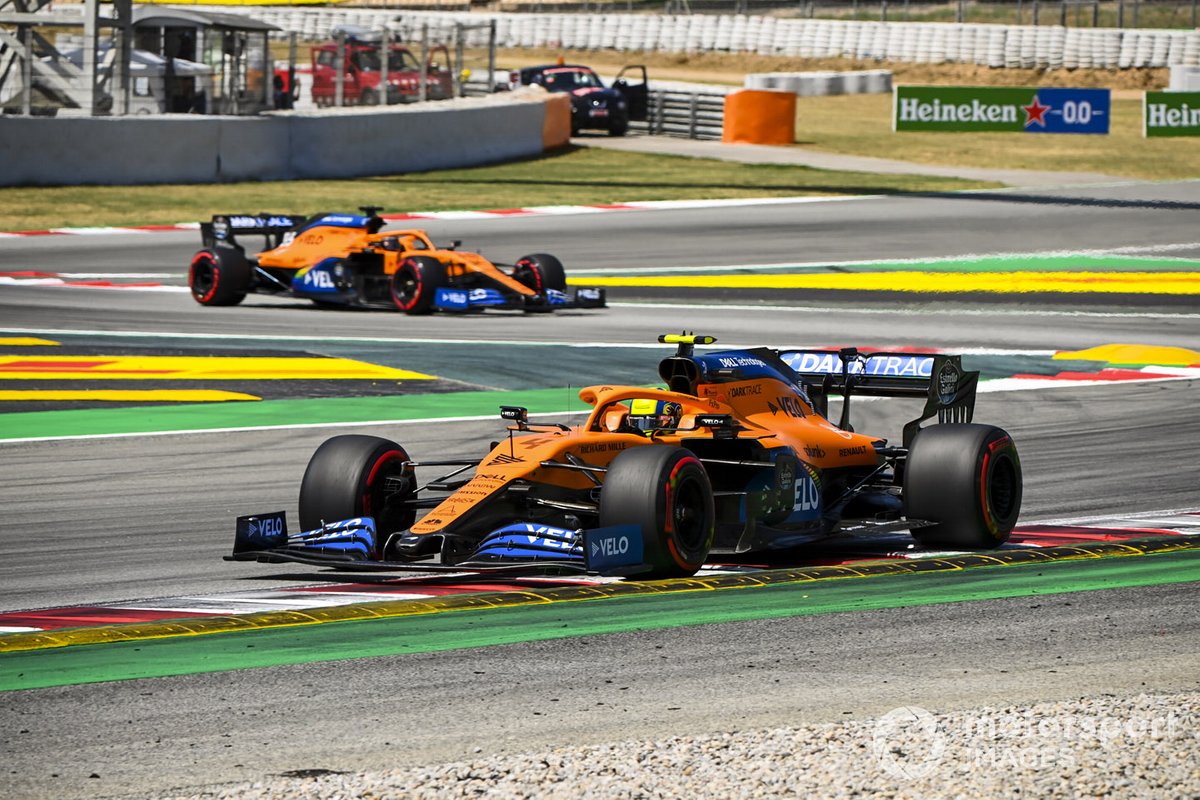 Lando Norris, McLaren MCL35, leads Carlos Sainz Jr., McLaren MCL35