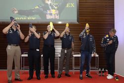 Daniel Ricciardo, Red Bull Racing and VIPs drink champagne from shoes at the ExxonMobil headquarters