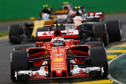Kimi Raikkonen, Ferrari SF70H, leads Kevin Magnussen, Haas F1 Team VF-17