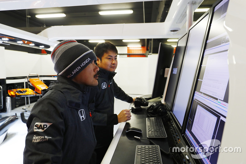 Honda team members examine data
