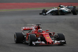 Kimi Raikkonen, Ferrari, leads Lewis Hamilton, Mercedes AMG F1 W08