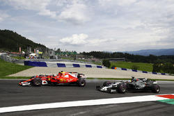 Kimi Raikkonen, Ferrari SF70H, battles Daniel Ricciardo, Red Bull Racing RB13 as Romain Grosjean, Haas F1 Team VF-17