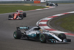 Lewis Hamilton, Mercedes AMG F1 W08, leads Sebastian Vettel, Ferrari SF70H, and Valtteri Bottas, Mercedes AMG F1 W08