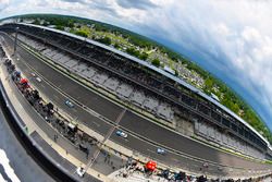 Cars come down pit road under red flag