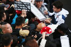 Lance Stroll, Williams, signs autographs for fans