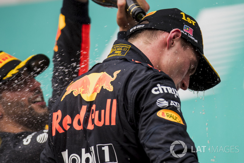 third place Daniel Ricciardo, Red Bull Racing, pours Champagne down the back of Max Verstappen, Red Bull Racing, race winner, on the podium