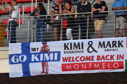 Kimi Raikkonen, Ferrari fans and banner