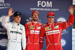 Polesitter Sebastian Vettel, Ferrari, second place Kimi Raikkonen, Ferrari, third place Valtteri Bottas, Mercedes AMG F1