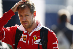 Sebastian Vettel, Ferrari, arrives in the paddock