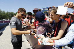 Stoffel Vandoorne, McLaren, signs autographs for fans