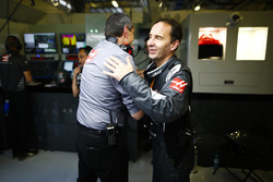 Guenther Steiner, Team Principal, Haas F1, and a Haas F1 engineer celebrate the team's best finish to date