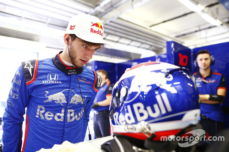 Pierre Gasly, Toro Rosso, examines his crash helmet