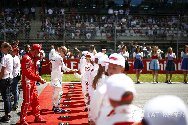 Sebastian Vettel, Ferrari, and Valtteri Bottas, Mercedes AMG F1, meet the Grid Kids