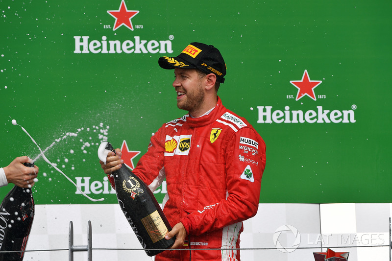 Sebastian Vettel, Ferrari celebrates on the podium with the cahmpagne