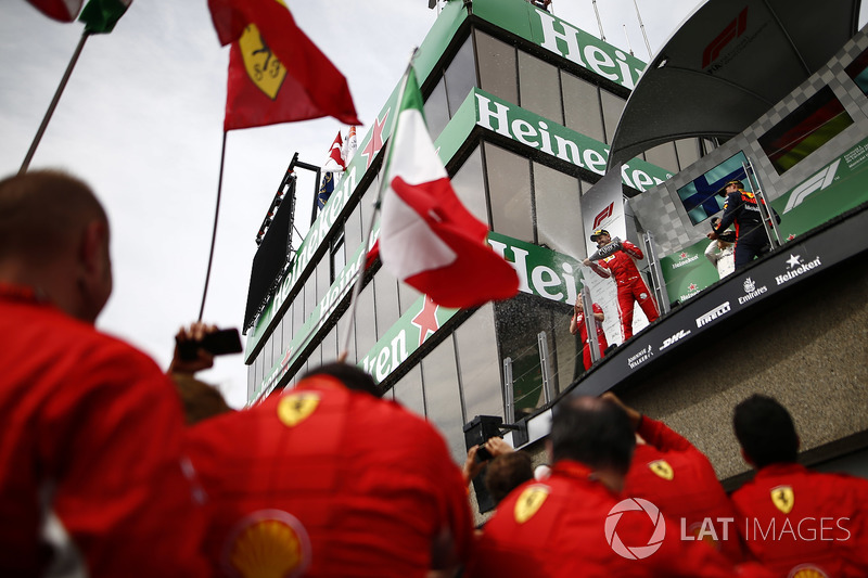 Sebastian Vettel, Ferrari, 1st position, and Max Verstappen, Red Bull Racing, 3rd position, spray Ch