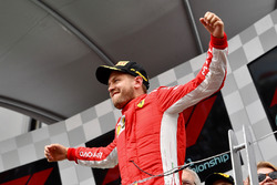 Race winner Sebastian Vettel, Ferrari celebrates on the podium