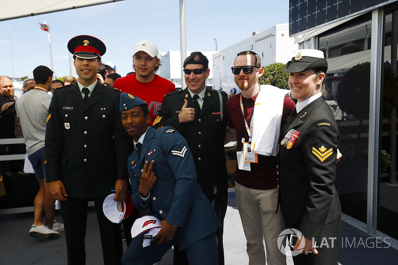 Members of the Canadian military meet hockey players Hampus Lindholm of Anaheim Ducks, and Pauleads