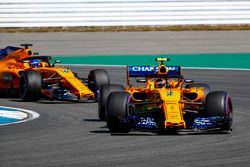 Stoffel Vandoorne, McLaren MCL33, leads Fernando Alonso, McLaren MCL33