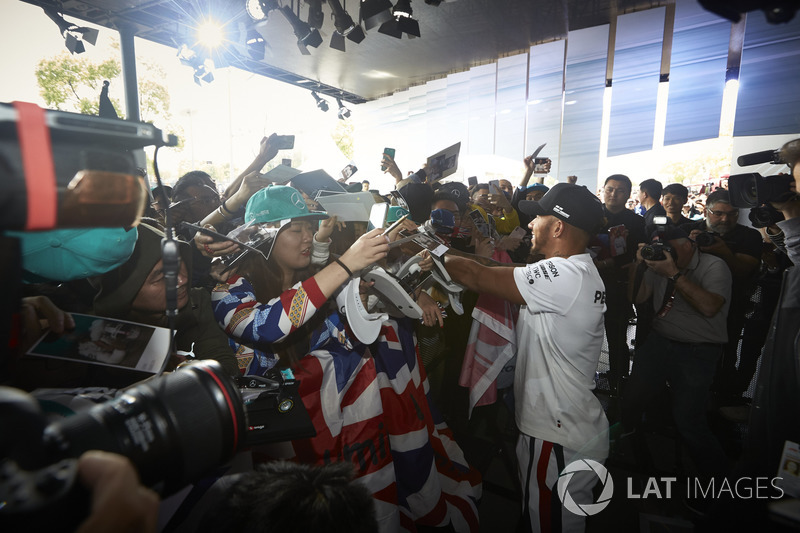 Lewis Hamilton, Mercedes AMG F1, signs autographs for fans