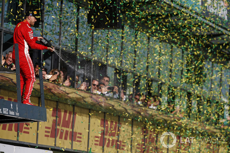 Sebastian Vettel, Ferrari, 1st position, sprays Champagne from the podium