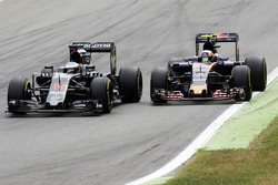 Fernando Alonso, McLaren MP4-31 and Carlos Sainz Jr., Scuderia Toro Rosso STR11 battle for position