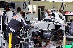 The Haas VF-16 of Romain Grosjean, Haas F1 Team is worked on in the second practice session