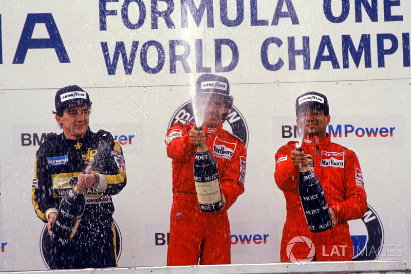 Podium: race winner Alain Prost, McLaren, second place Ayrton Senna, Lotus, Michele Alboreto, Ferrar