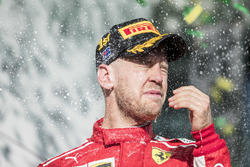 Sebastian Vettel, Ferrari, 1st position, celebrates on the podium with Champagne