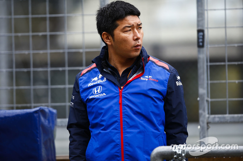 A Honda team member on the pit wall
