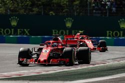 Sebastian Vettel, Ferrari SF71H, leads Kimi Raikkonen, Ferrari SF71H