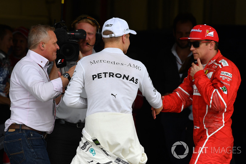 Polesitter Valtteri Bottas, Mercedes AMG F1 celebrates with Kimi Raikkonen, Ferrari in parc ferme as Johnny Herbert, Sky TV looks on