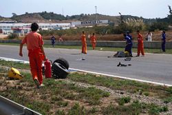 Martin Donnelly, Team Lotus, lies on the track after a horrific crash