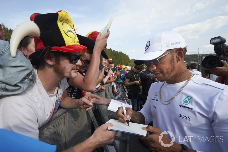 Lewis Hamilton, Mercedes AMG F1, signs autographs for fans