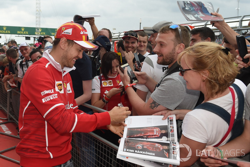 Sebastian Vettel, Ferrari signs autographs for the fans at the autograph session