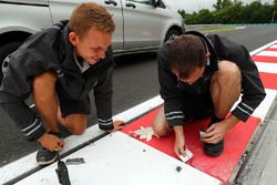 Track workers working on the kerbs and the track