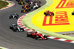 Sebastian Vettel, Ferrari SF70H, Lewis Hamilton, Mercedes AMG F1 W08, Valtteri Bottas, Mercedes AMG F1 W08, the rest of the field as Kimi Raikkonen, Ferrari SF70H, runs wide after contact